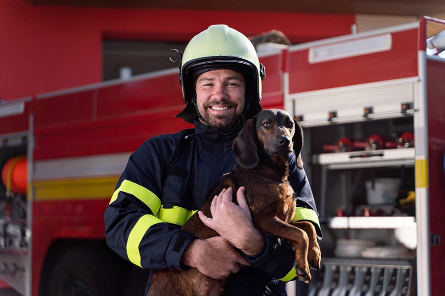 fire-fighter with a dog